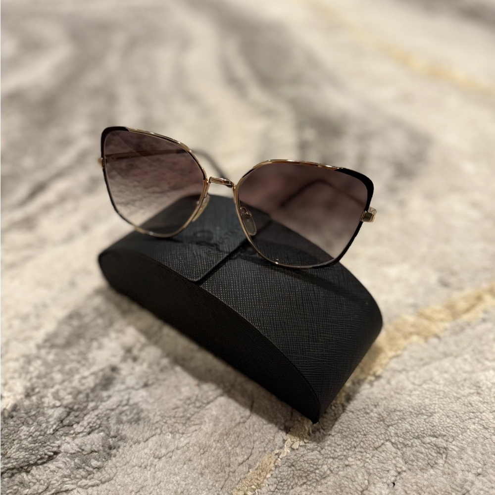 Prada Women's Sunglasses in Black and Gold